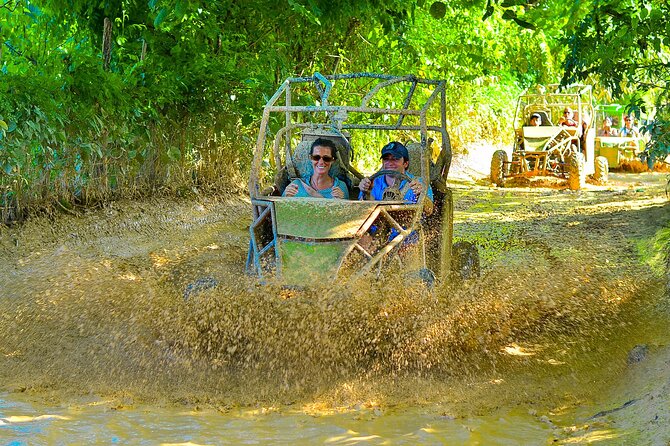 Full Day Adventure Buggy Ride and Party Boat - Macao Buggies: Dirt Roads, a Turquoise Cenote, and Helmet Time