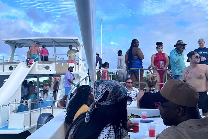 Half-Day Tour with Punta Cana Beach Boat Party - The boat party setup: catamaran, speedboat, and the seating reality