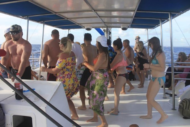 Party boat in Catamaran with Open Bar Only Adults + Snorkeling - Dolphins, Rain, and Real-Life Conditions on the Water