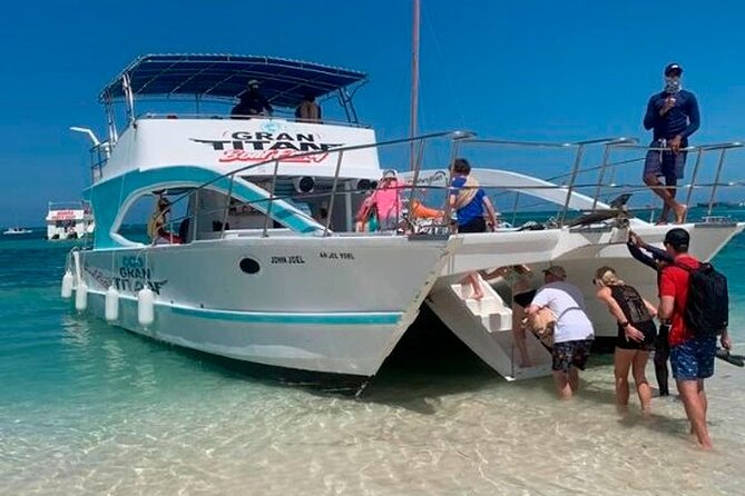 Party Boat in Punta Cana with Drinks and Transportation Included - The dolphin-viewing stop: quick, scenic, and not a guaranteed show
