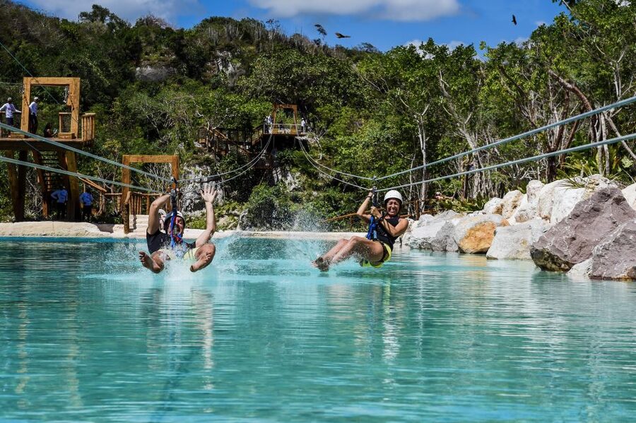 Punta Cana: Blue Hole and Scape Park Cap Cana Entry Ticket - Zip Line Eco Splash: gliding through water fountains and cannons