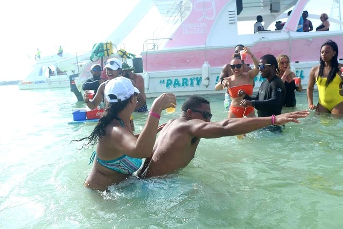 Punta Cana Private Booze Cruise with Open Bar (10+ People) - The coastal cruise view: classic Punta Cana hotel zone time