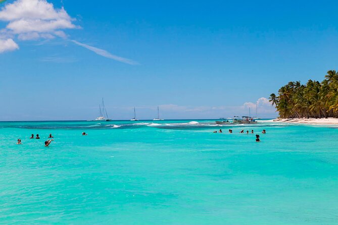 Saona Island Catamaran Adventure with Free Food and Transportation - Catamaran return with animation, music, and dancing
