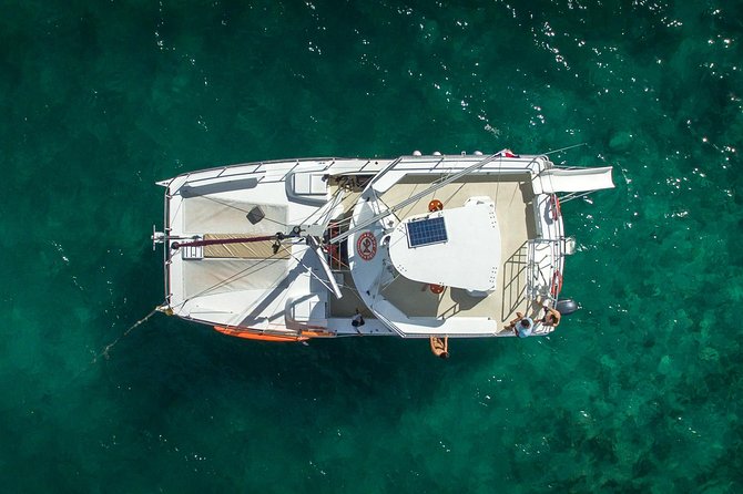 Small Group Snorkeling Cruise with Open Bar and Light Snacks - Gear up, then play: slide, swim, and an active crew vibe